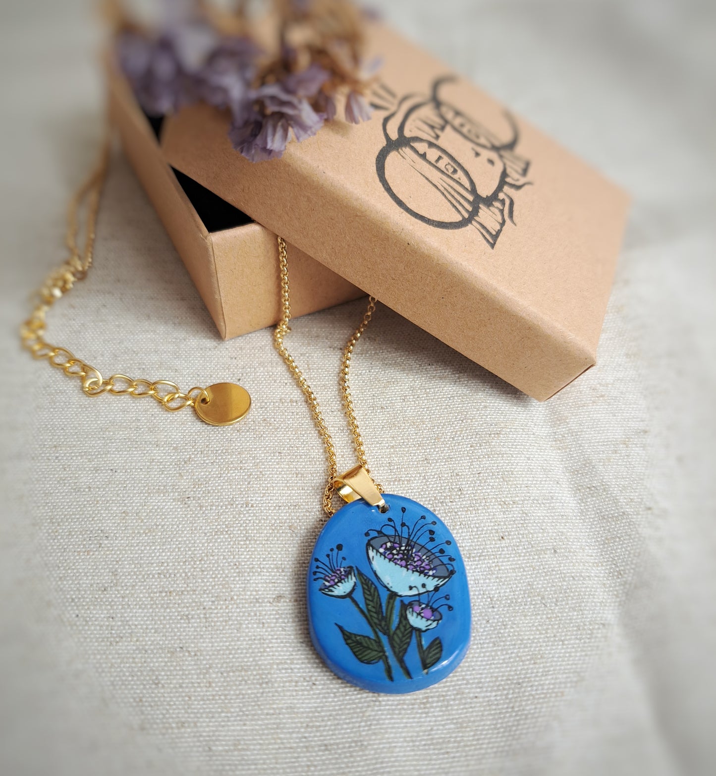 Collier fleur bleu argile/acrylique - plaqué or 18k