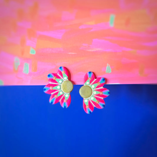 Clip d'oreilles demies fleurs rose fluo